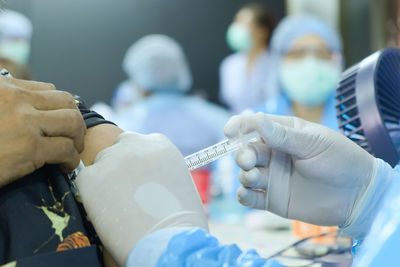 Close-up of man holding hands