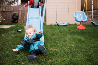 Boy playing on grass