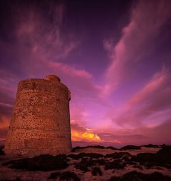Low angle view of dramatic sky during sunset