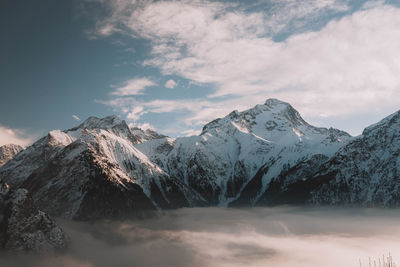 Scenic view of snowcapped mountains against sky