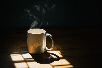 Close-up of coffee cup on table