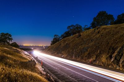 Light trails on country road at night