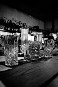 Close-up of wine glasses on table