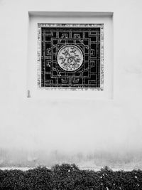 Low angle view of window on wall of building