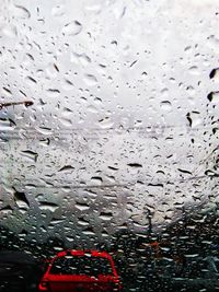 Close-up of wet car window in rainy season