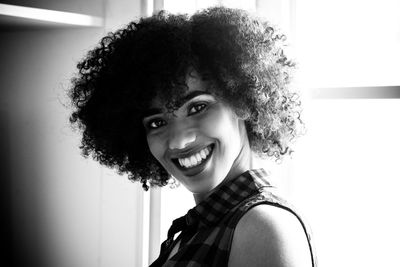 Close-up portrait of smiling young woman