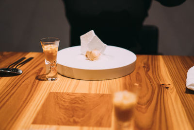 Close-up of wine glasses on table