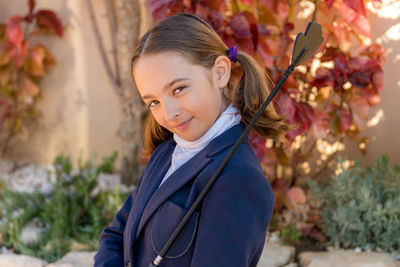 Portrait of smiling girl standing outdoors