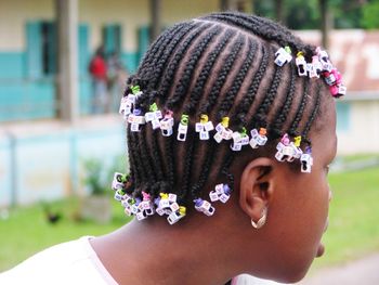 Close-up of girl with dreadlocks looking away