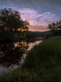 Scenic view of lake against sky during sunset