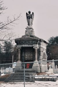 Low angle view of statue against sky