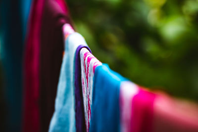 Close-up of multi colored flags against blurred background