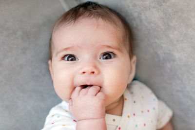 Funny baby biting fingers