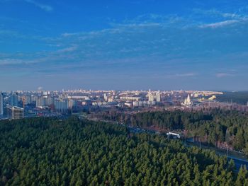 High angle view of trees and buildings against sky