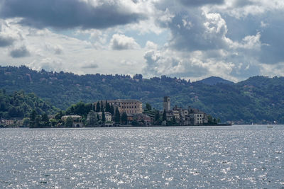 Scenic view of sea and buildings against sky