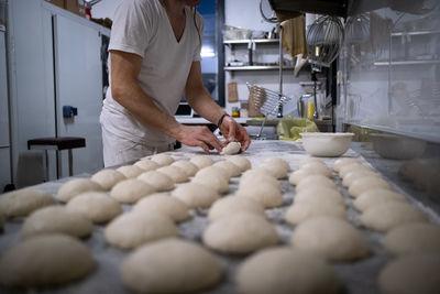 Midsection of man preparing food