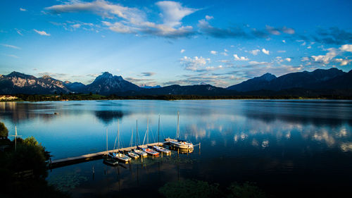 Boat in lake against blue sky