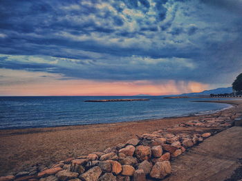 Scenic view of sea against cloudy sky