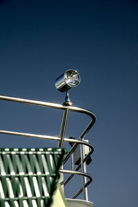 Low angle view of lighting equipment against clear sky