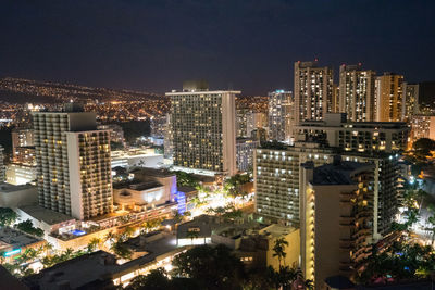 High angle view of illuminated city buildings at night