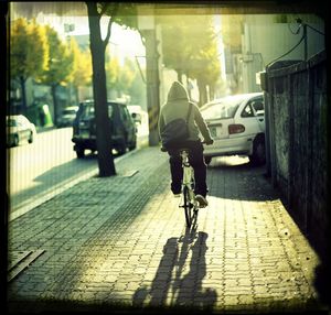 Woman walking on sidewalk