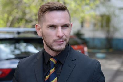 Close-up of handsome businessman looking away