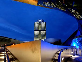 Low angle view of illuminated building against blue sky