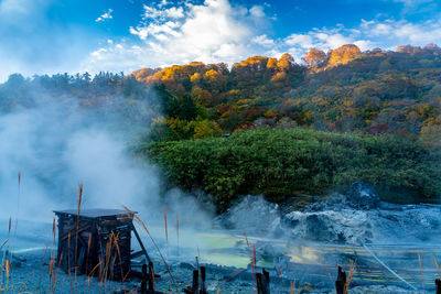 Scenic view of white steam against sky