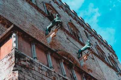 Low angle view of old building against sky