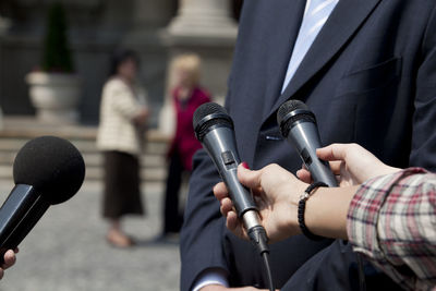 Close-up of man holding mobile phone