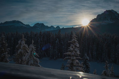 Scenic view of snowcapped mountains against sky during sunset