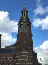 Low angle view of clock tower against sky