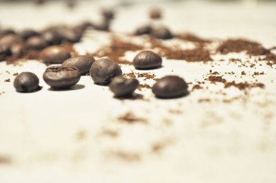 Close-up of coffee beans on sand