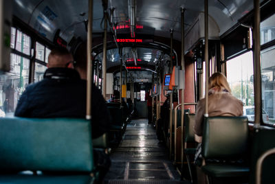 Rear view of people sitting in bus