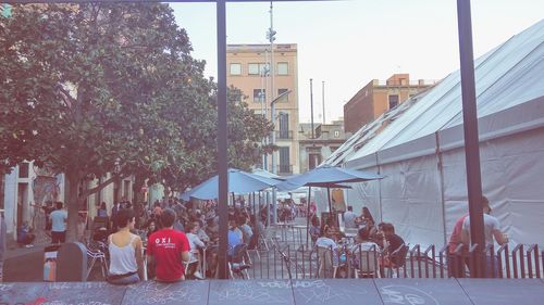 People sitting in front of buildings