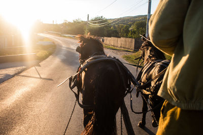 People riding motorcycle against sky