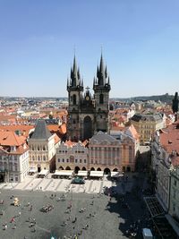 Buildings in city against clear sky