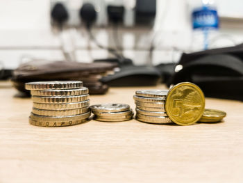 Close-up of coins on table