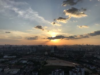 High angle view of city during sunset