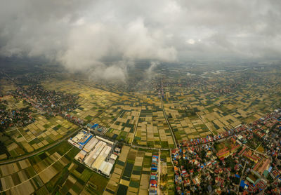 High angle view of illuminated cityscape against sky