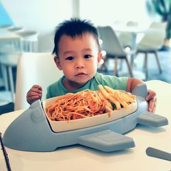 Boy waiting for big aeroplane kids meal