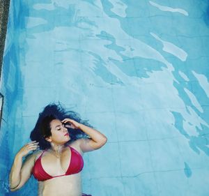 High angle view of young woman in swimming pool