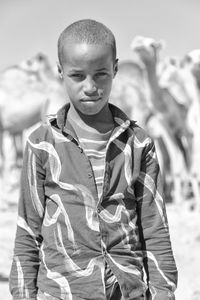 Portrait of boy standing outdoors