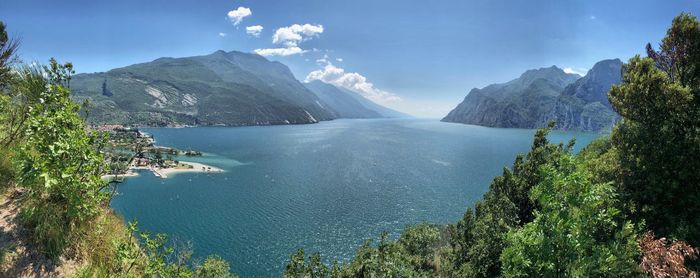 Panoramic view of sea and mountains against sky