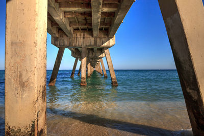 Deerfield beach pier under a blue sky in deerfield, florida