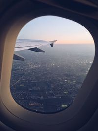 Aerial view of city seen through airplane window
