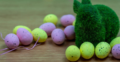 Close-up of multi colored eggs on table