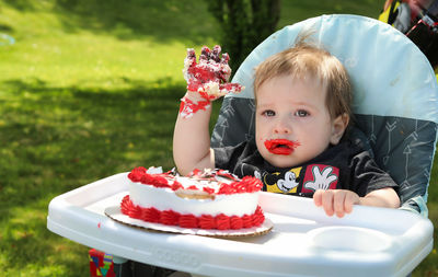 Portrait of cute girl with cake