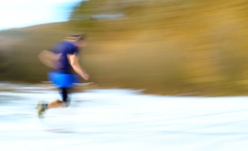 Blurred motion of man running