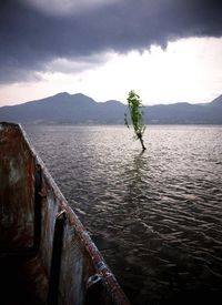 Scenic view of mountains against cloudy sky